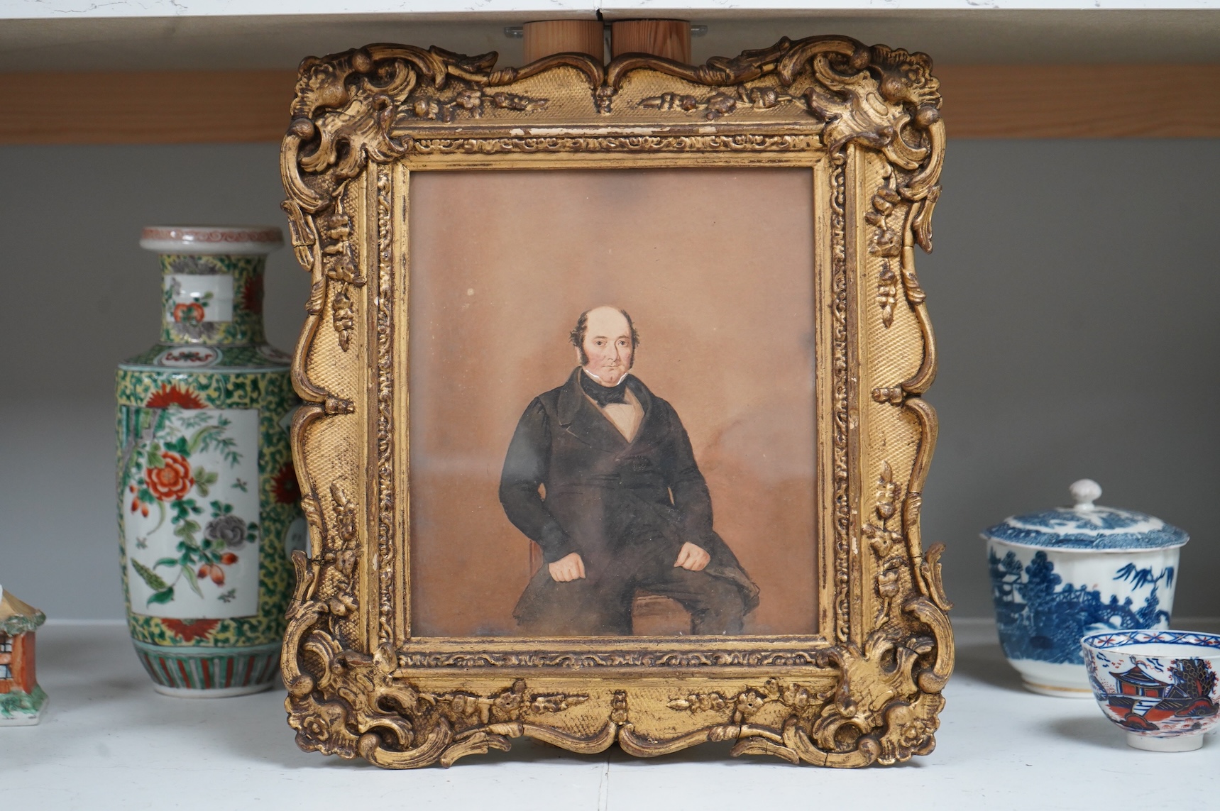 19th century School, Three-quarter length portrait of a gentleman wearing military dress, unsigned, watercolour, together with two other portraits of Victorian gentleman, largest 27 x 20cm, one housed in an ornate gilt f